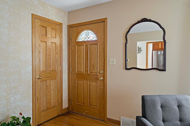 entrance foyer featuring light hardwood / wood-style floors