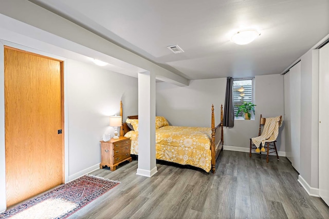 bedroom with wood-type flooring