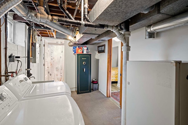 washroom with independent washer and dryer, electric panel, and light colored carpet