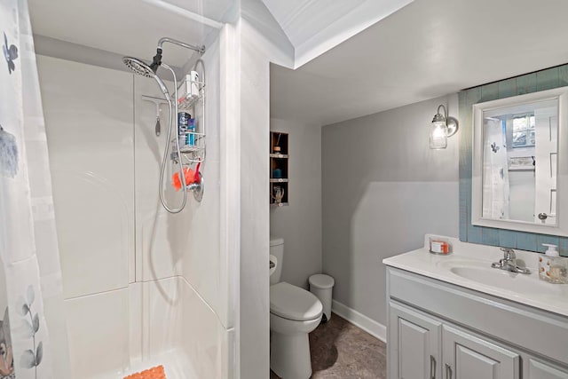 bathroom with toilet, curtained shower, and vanity