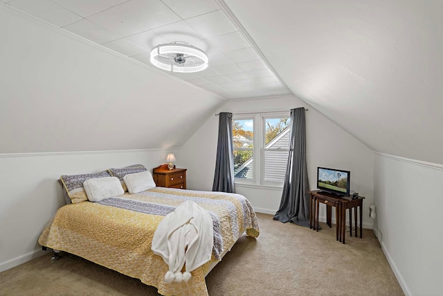 carpeted bedroom featuring vaulted ceiling