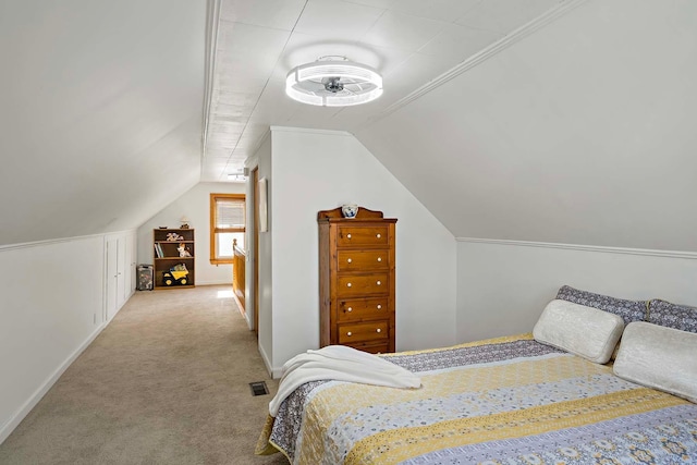 carpeted bedroom with vaulted ceiling