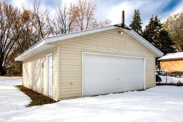 view of snow covered garage