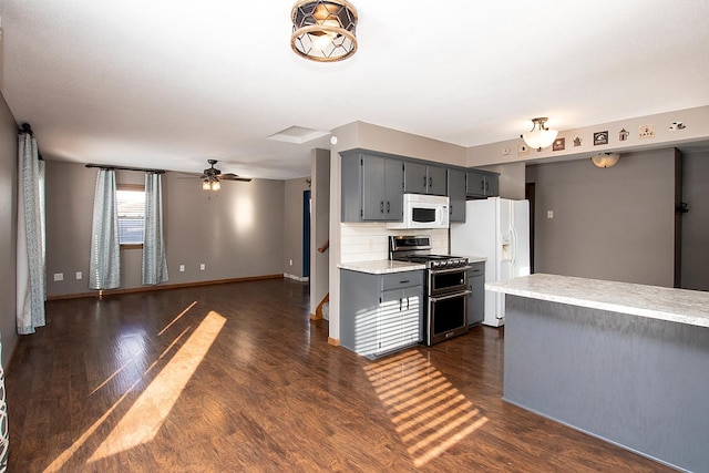 kitchen with backsplash, ceiling fan, dark hardwood / wood-style flooring, and white appliances