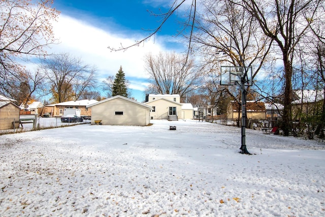 view of yard covered in snow