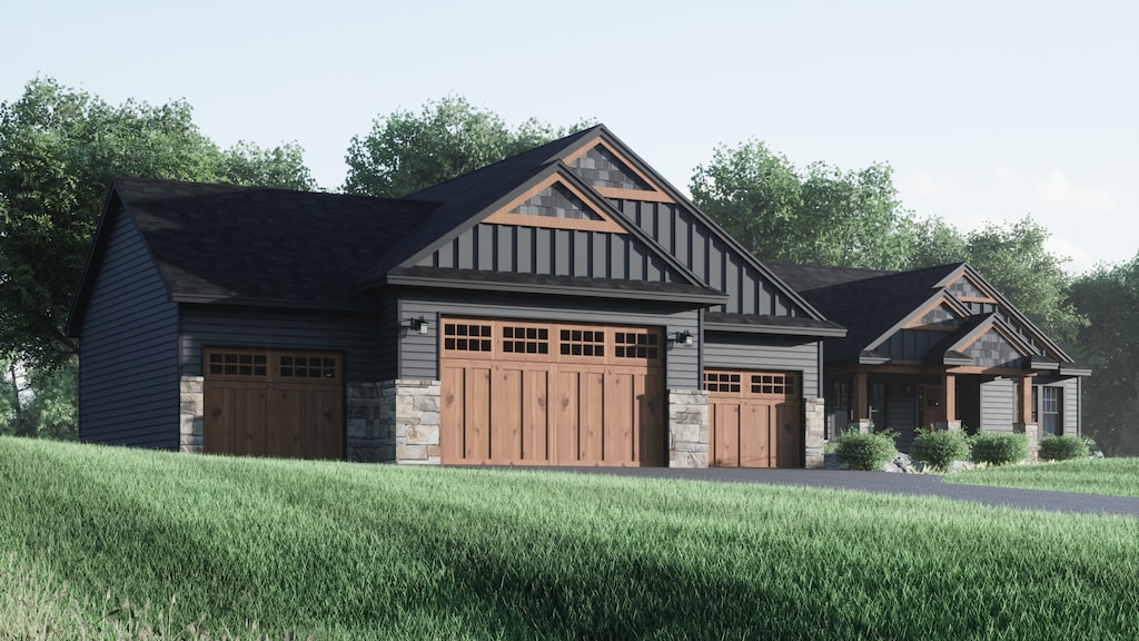 view of front of property featuring a front yard and a garage