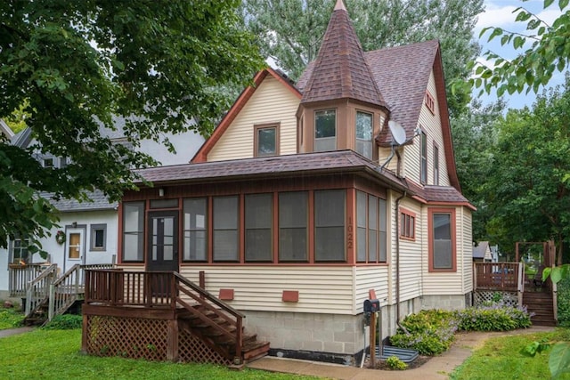 back of house featuring a deck