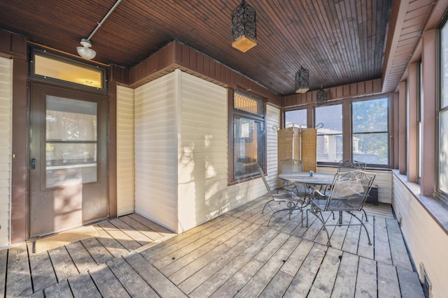 unfurnished sunroom featuring wood ceiling