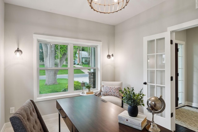 home office with a notable chandelier