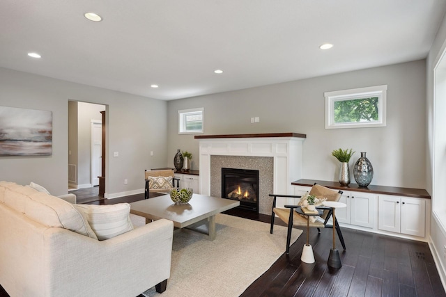 living room featuring dark hardwood / wood-style flooring and plenty of natural light