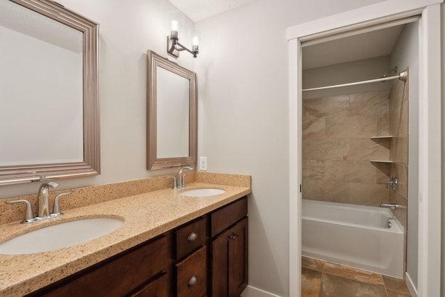 bathroom featuring vanity, tiled shower / bath, and tile patterned floors