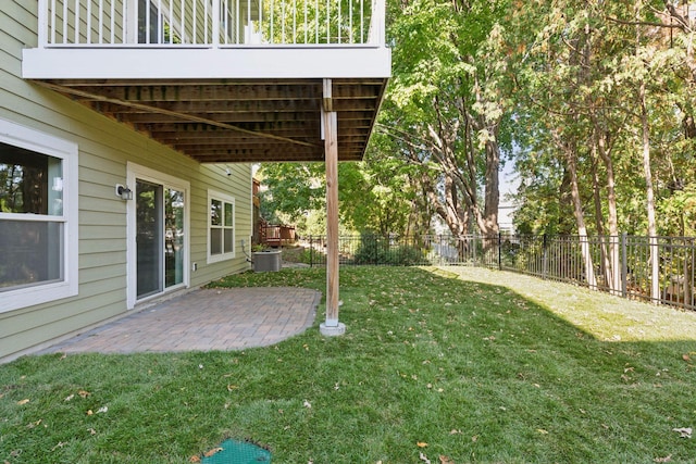 view of yard featuring central air condition unit and a patio area