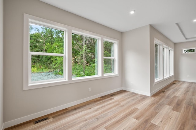 unfurnished room featuring light hardwood / wood-style floors