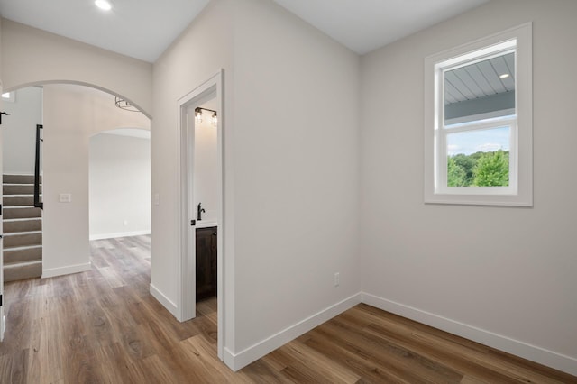 hallway with wood-type flooring