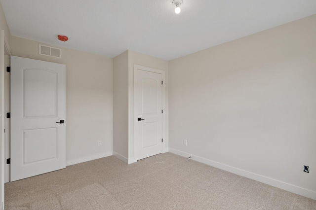 unfurnished bedroom with light carpet