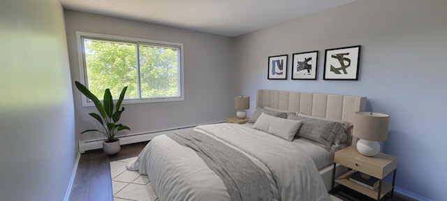 bedroom featuring light hardwood / wood-style floors and baseboard heating