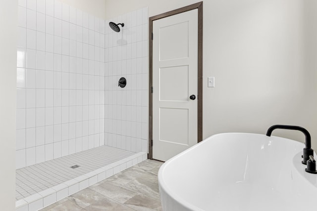 bathroom with separate shower and tub