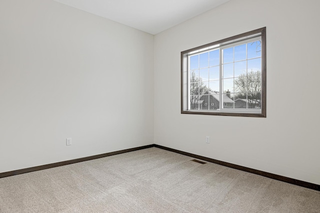 unfurnished room with carpet flooring