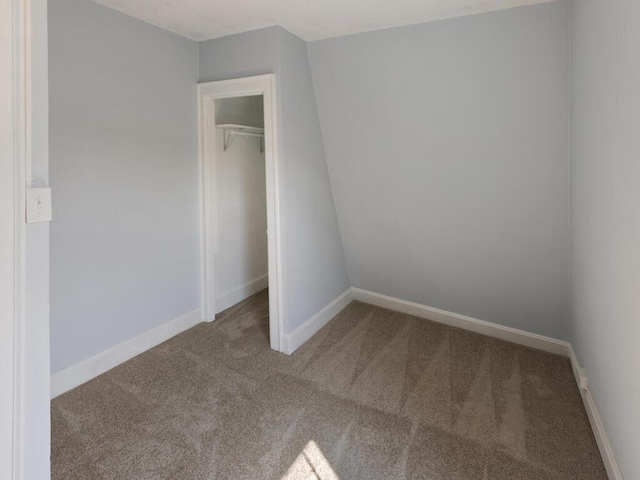 unfurnished bedroom with carpet floors and a closet