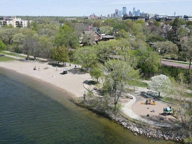 bird's eye view featuring a view of the beach and a water view