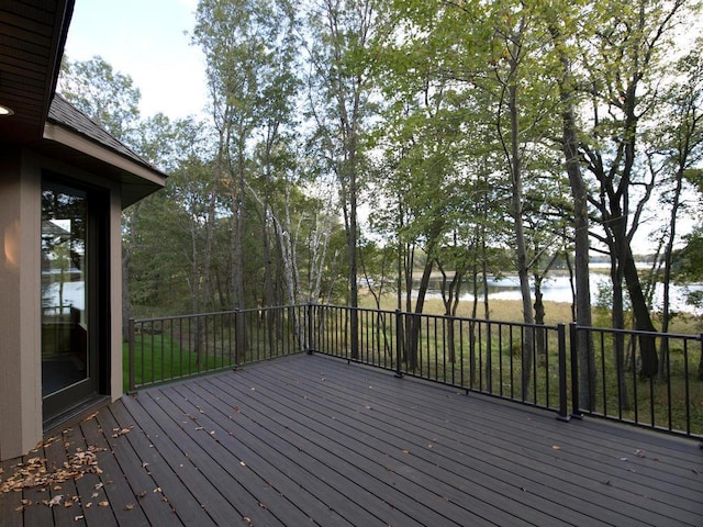 wooden deck featuring a water view