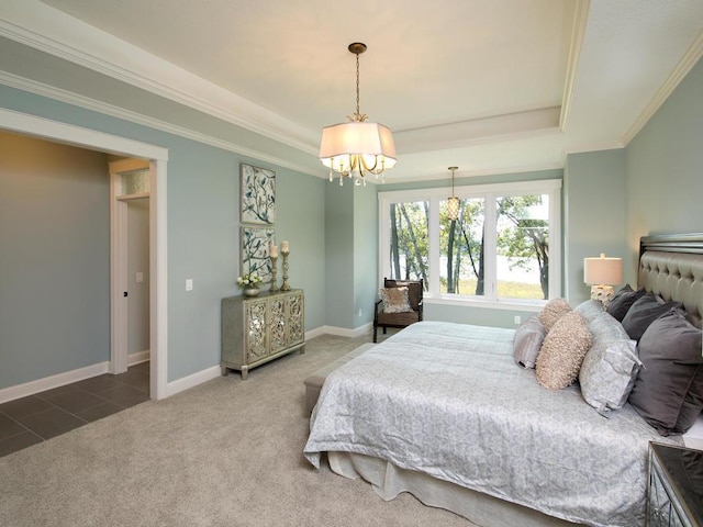 bedroom with a tray ceiling, carpet, crown molding, and a chandelier