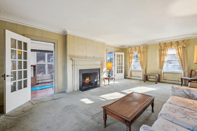 living room featuring ornamental molding, light carpet, and a baseboard radiator