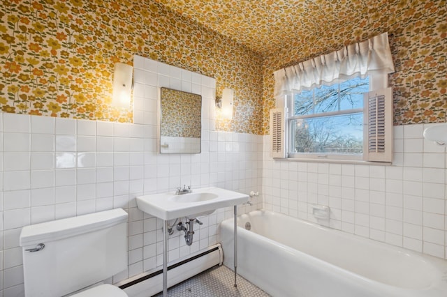 bathroom featuring a washtub, a baseboard radiator, tile walls, and toilet