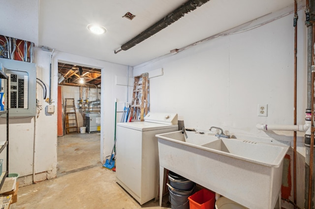 laundry room featuring washer / clothes dryer, electric panel, and sink