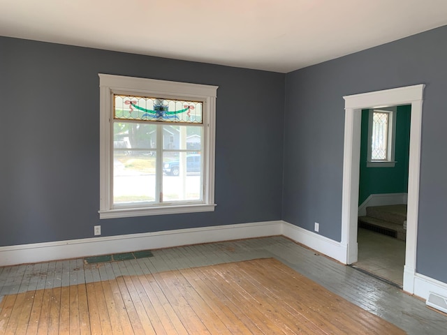 spare room with hardwood / wood-style flooring