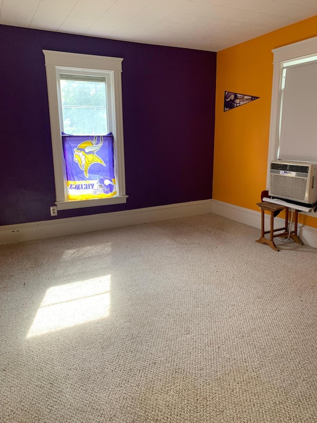 carpeted empty room with cooling unit