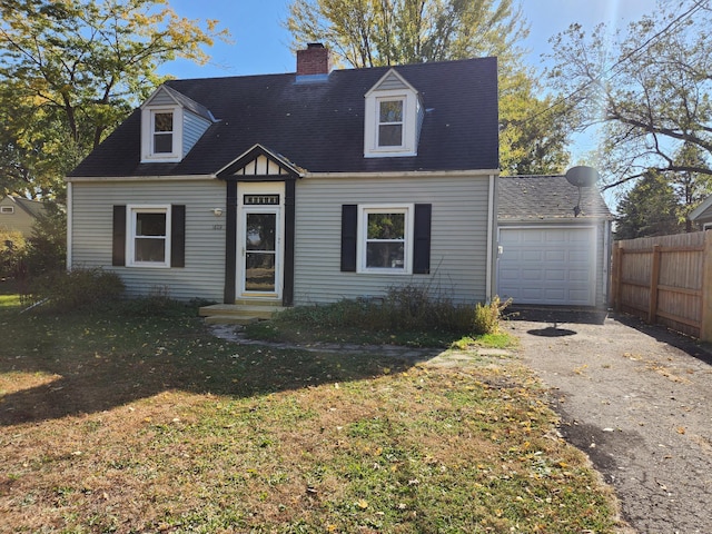 cape cod-style house with a front lawn and a garage