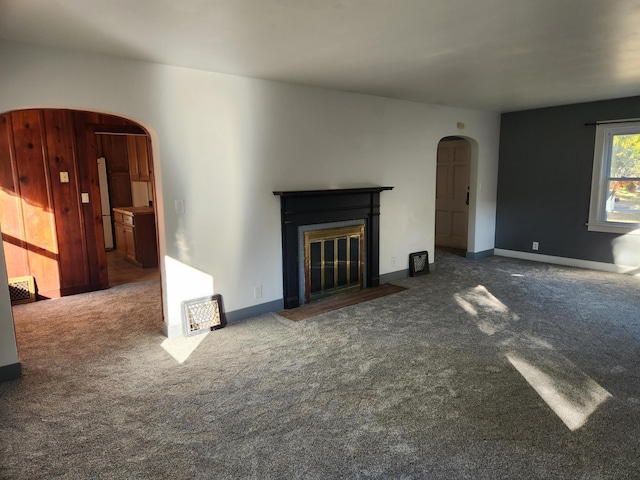 unfurnished living room featuring carpet flooring