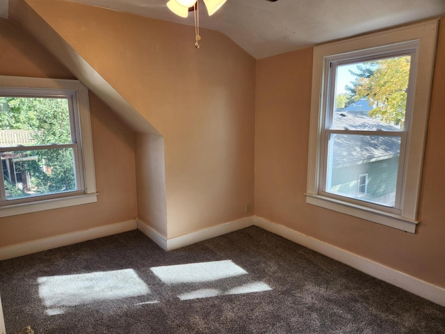 bonus room featuring carpet flooring and lofted ceiling