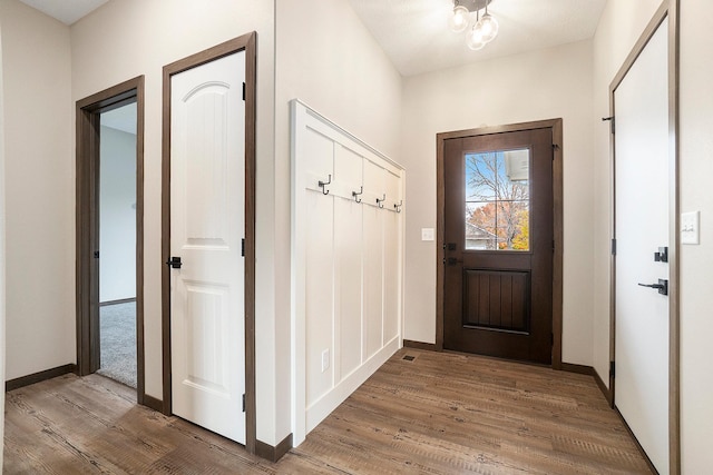 mudroom with hardwood / wood-style floors