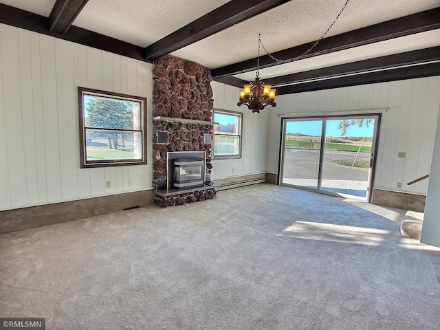 unfurnished living room featuring beam ceiling, carpet, a wealth of natural light, and a chandelier