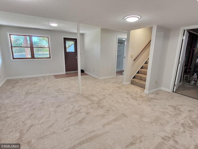 basement with light colored carpet