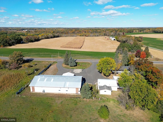 birds eye view of property with a rural view