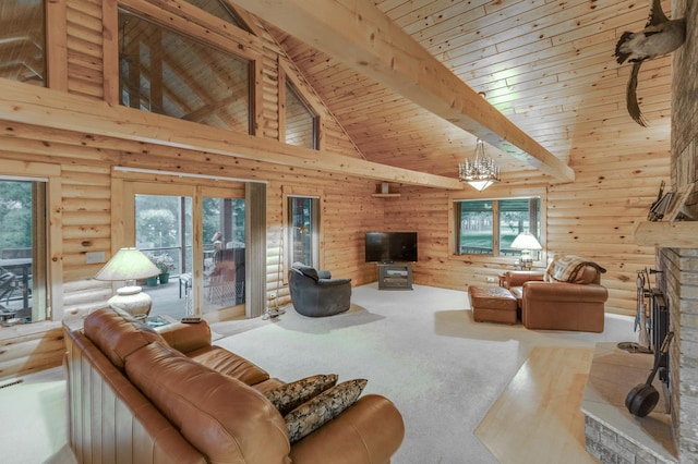 living room with a wealth of natural light, beam ceiling, and log walls