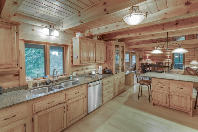 kitchen with dishwasher, beam ceiling, a kitchen breakfast bar, sink, and light hardwood / wood-style floors