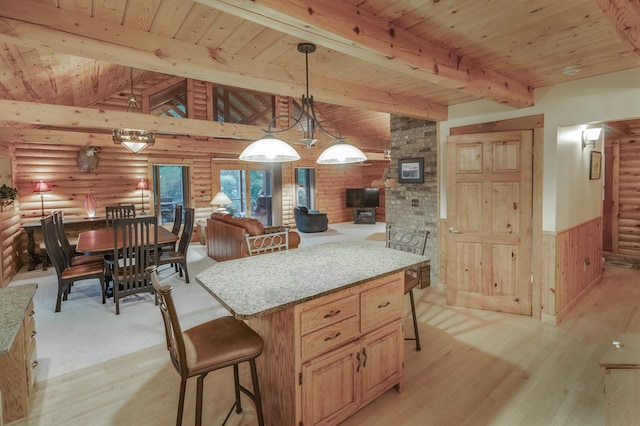 kitchen featuring light hardwood / wood-style floors, wooden ceiling, decorative light fixtures, and vaulted ceiling with beams