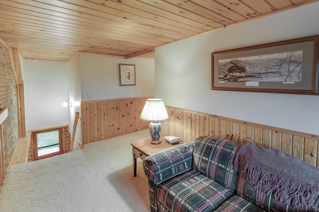 living area with wood ceiling, wood walls, and carpet floors