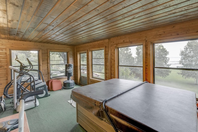 sunroom / solarium with a hot tub and wooden ceiling