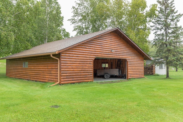 garage featuring a yard