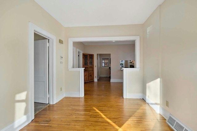 corridor featuring light hardwood / wood-style floors