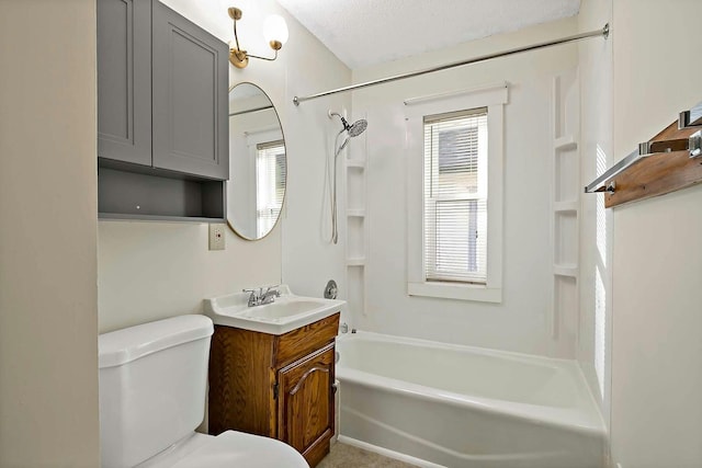 full bathroom featuring toilet, shower / washtub combination, a healthy amount of sunlight, and vanity