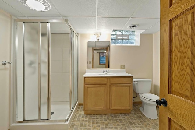 bathroom featuring toilet, walk in shower, and vanity