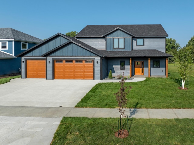 view of front facade with a front lawn and a garage