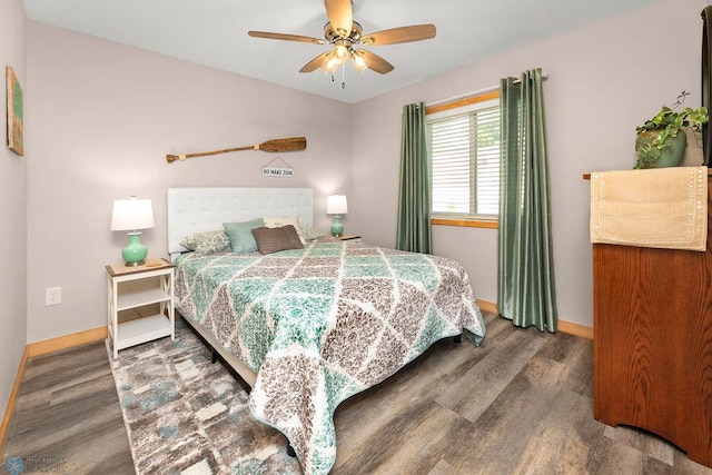 bedroom featuring ceiling fan and dark wood-type flooring