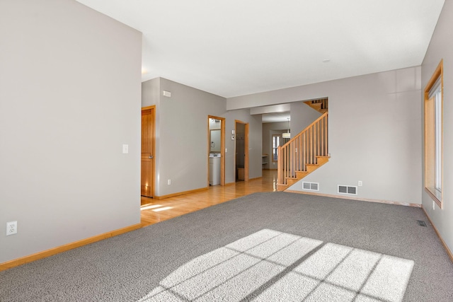 unfurnished living room with light wood-type flooring